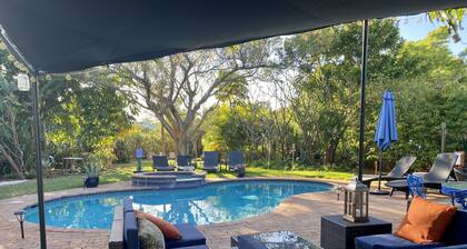 Short Walk to Beach/Town-Artistic Apt., Gorgeous Garden W/ Beautiful Shared Pool