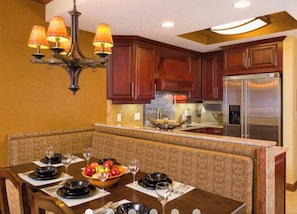 Enjoy family meals and gatherings in this well-appointed kitchen with an oven, microwave, and refrigerator.