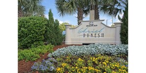 A sign for Ariel Dunes II on Seascape Blvd.