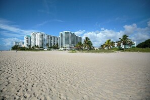 On the beach, sun-loungers, beach towels
