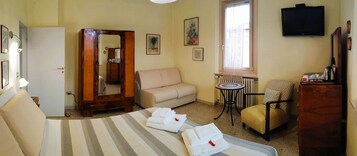 Family Triple Room | Minibar, in-room safe, blackout drapes, soundproofing