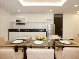 Apartment, 4 Bedrooms (1 King Bed,1 Queen Bed & 3 Single Bed) | Private kitchen | Microwave, electric kettle