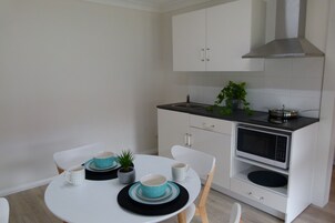 one bedroom apartment self contained | Private kitchenette | Full-size fridge, microwave, stovetop, coffee/tea maker