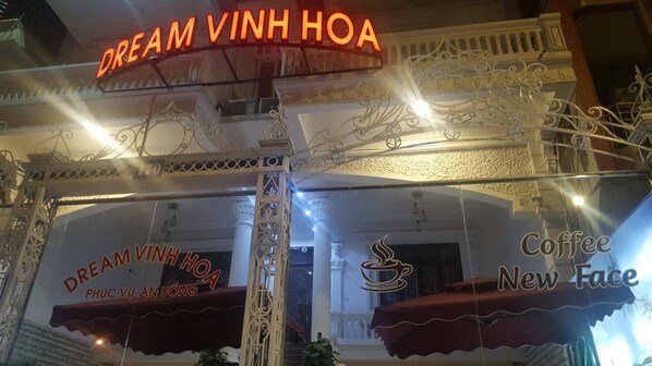 A building with ornate white railings and a sign that reads "DREAM VINH HOA PHU CUA ANUONG". - Dream Vinh Hoa (Bac Ninh)