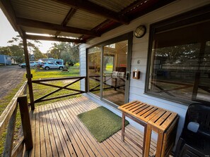 Standard Cabin 2 Bedrooms Shared Bathroom (1 King Bed, 1 Bunk, 1 Trundle) | Terrace/patio - Bimbi Park - Camping Under Koala (Cape Otway)