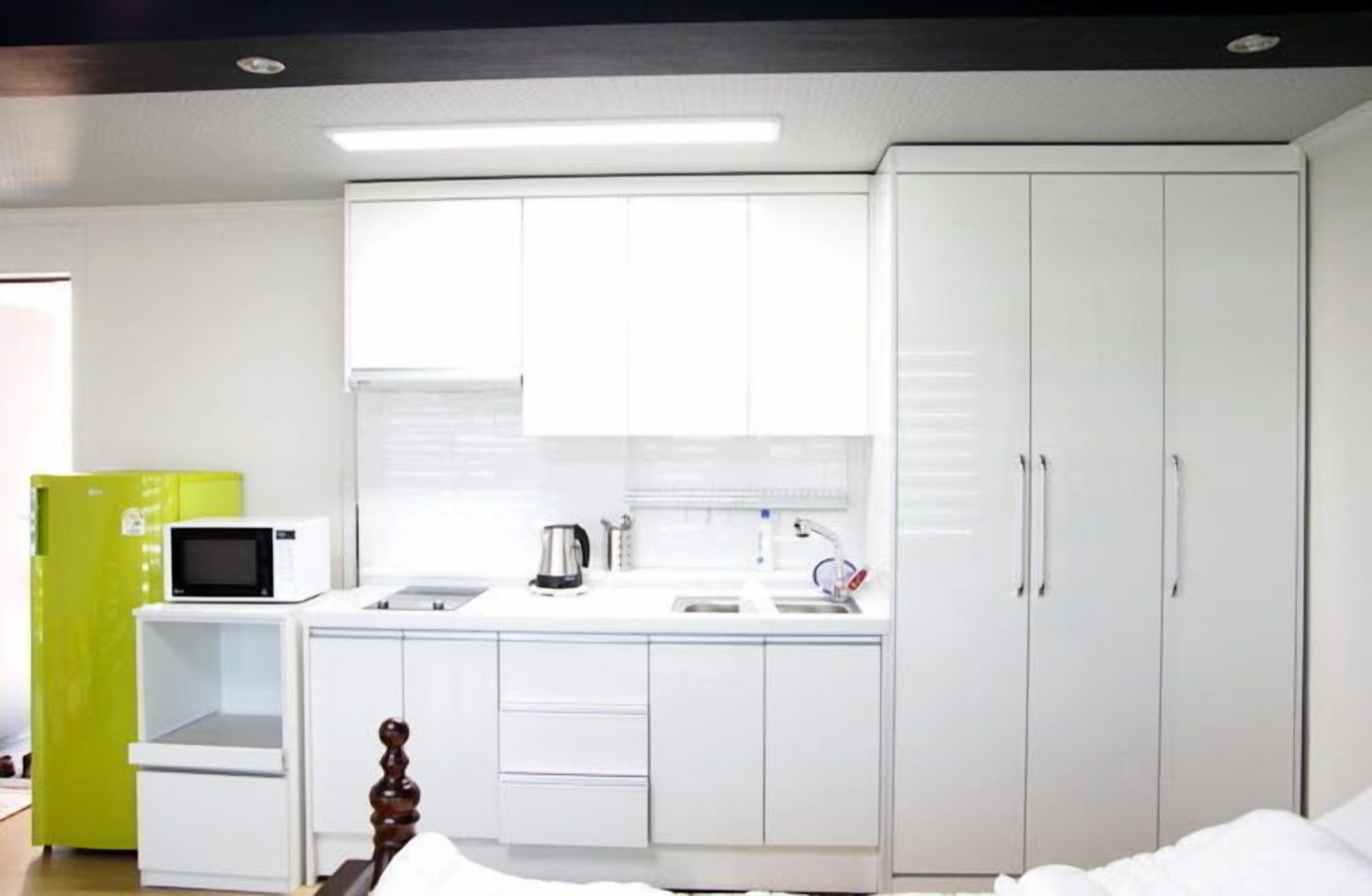 yellow room | private kitchenette | full-sized fridge, microwave, stovetop, electric kettle