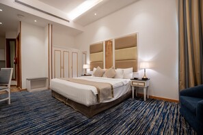 Deluxe Double Room | Minibar, in-room safe, blackout curtains, iron/ironing board