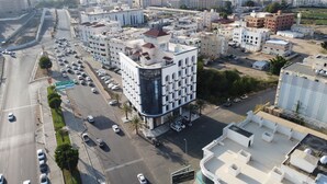 A multi-story building with a prominent sign reading "PLATINUM ALKHASEEN". - Platinum Alkhamseen Serviced Apartments (Taif)