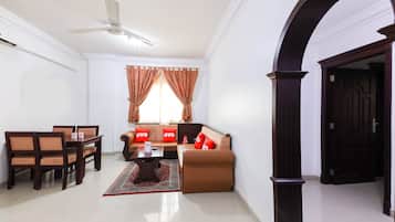 Deluxe Apartment, 2 Bedrooms | Living room | 32-inch flat-screen TV with satellite channels, TV