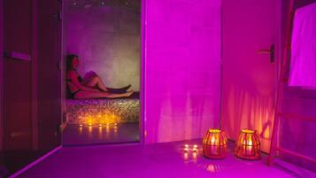Relax in a serene spa room with a bench and tranquil ambiance.