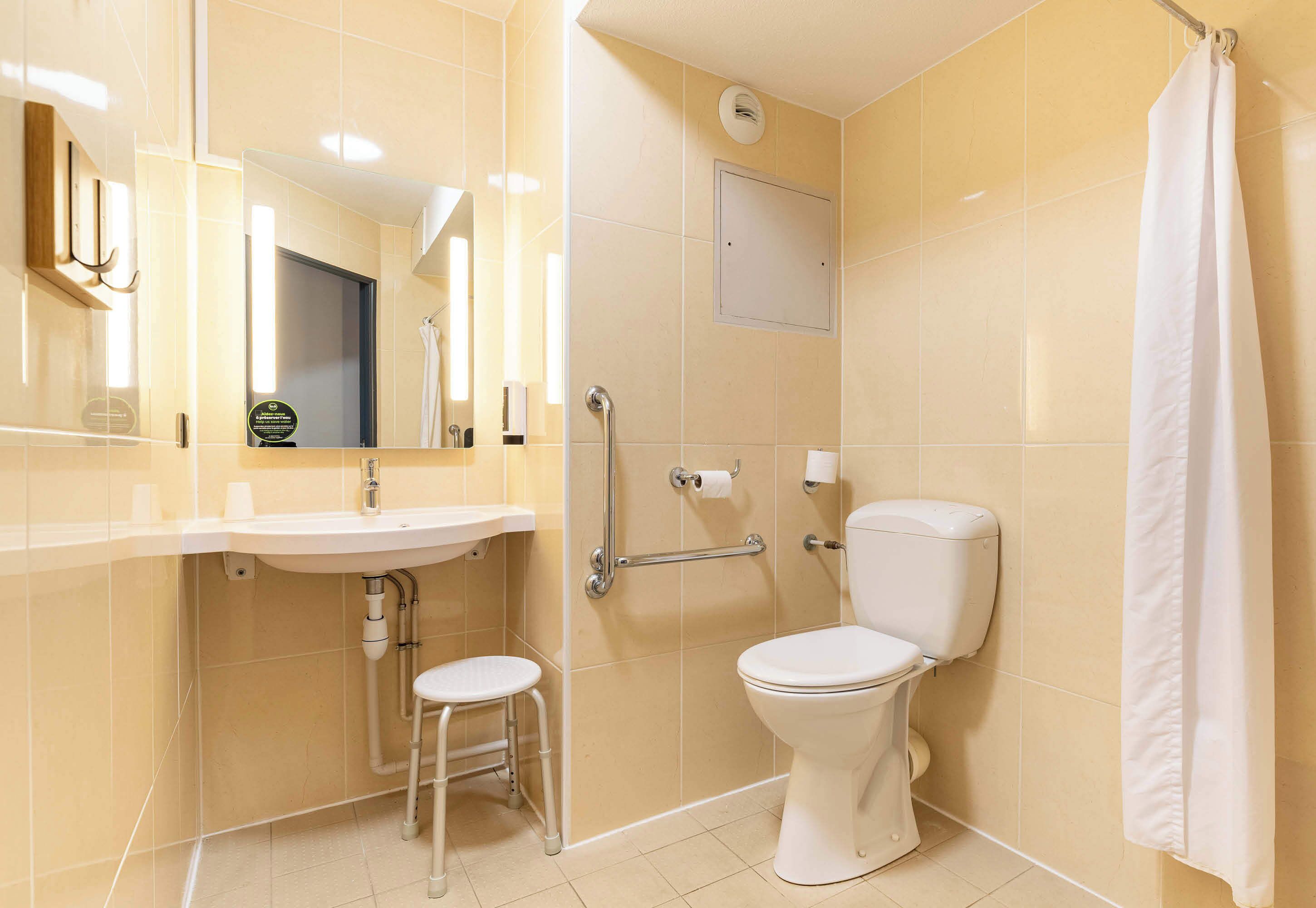 double room, mobility accessible | bathroom | shower, towels, soap, shampoo