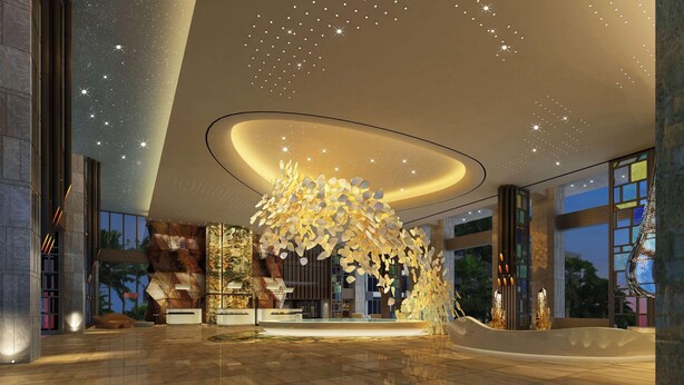 Un hall d’entrée spacieux, agrémenté d’un lustre moderne, d’un espace salon central et de grandes fenêtres offrant une vue sur l’extérieur.