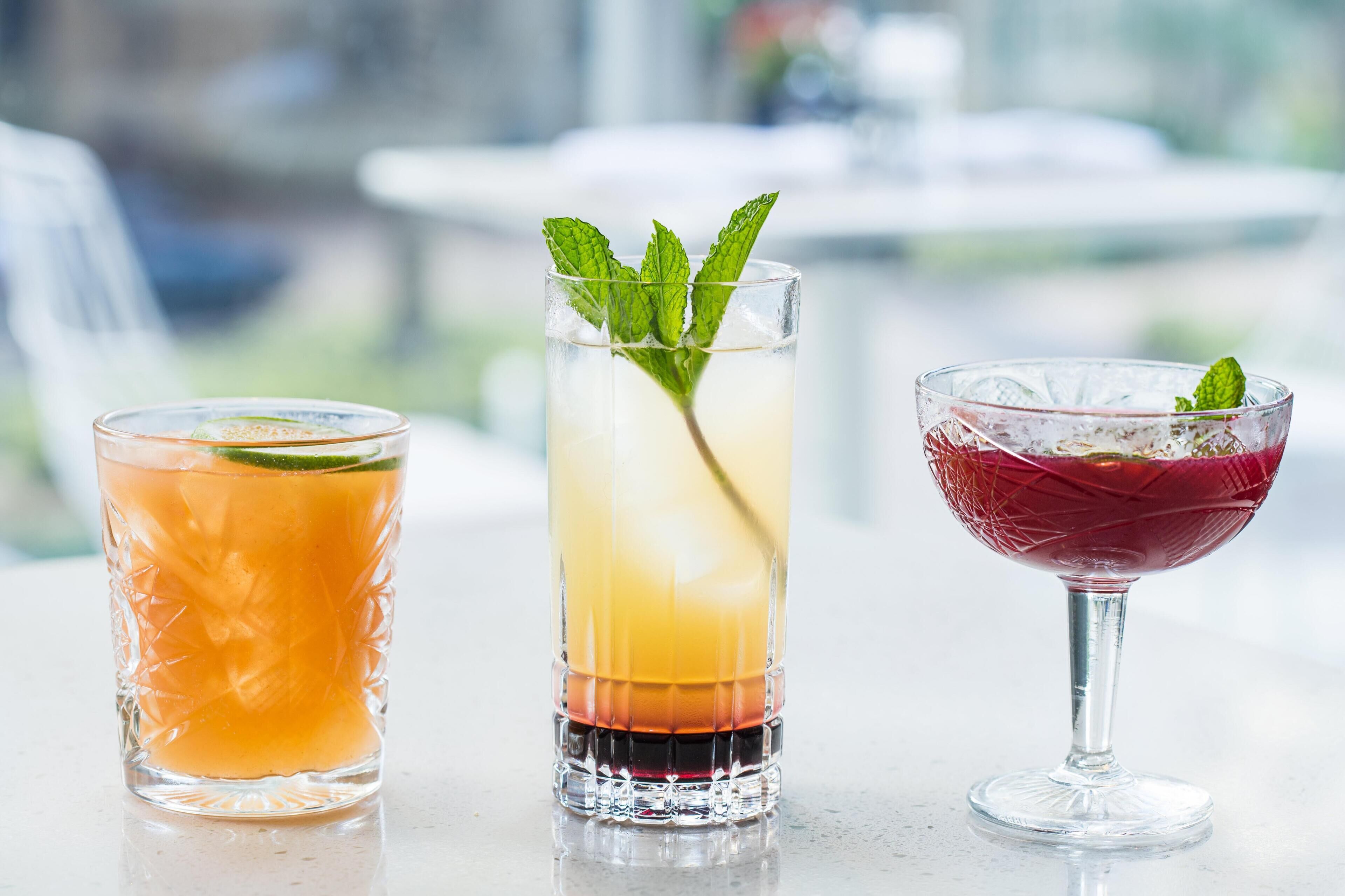 Three different types of drinks in glasses.