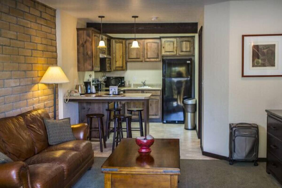 luxury suite, 1 king bed, river view | 1 bedroom, desk, iron/ironing board, free wifi