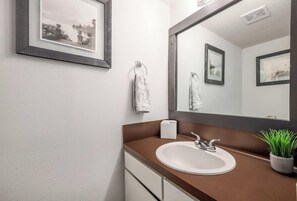 Combined shower/tub, hair dryer, towels, soap