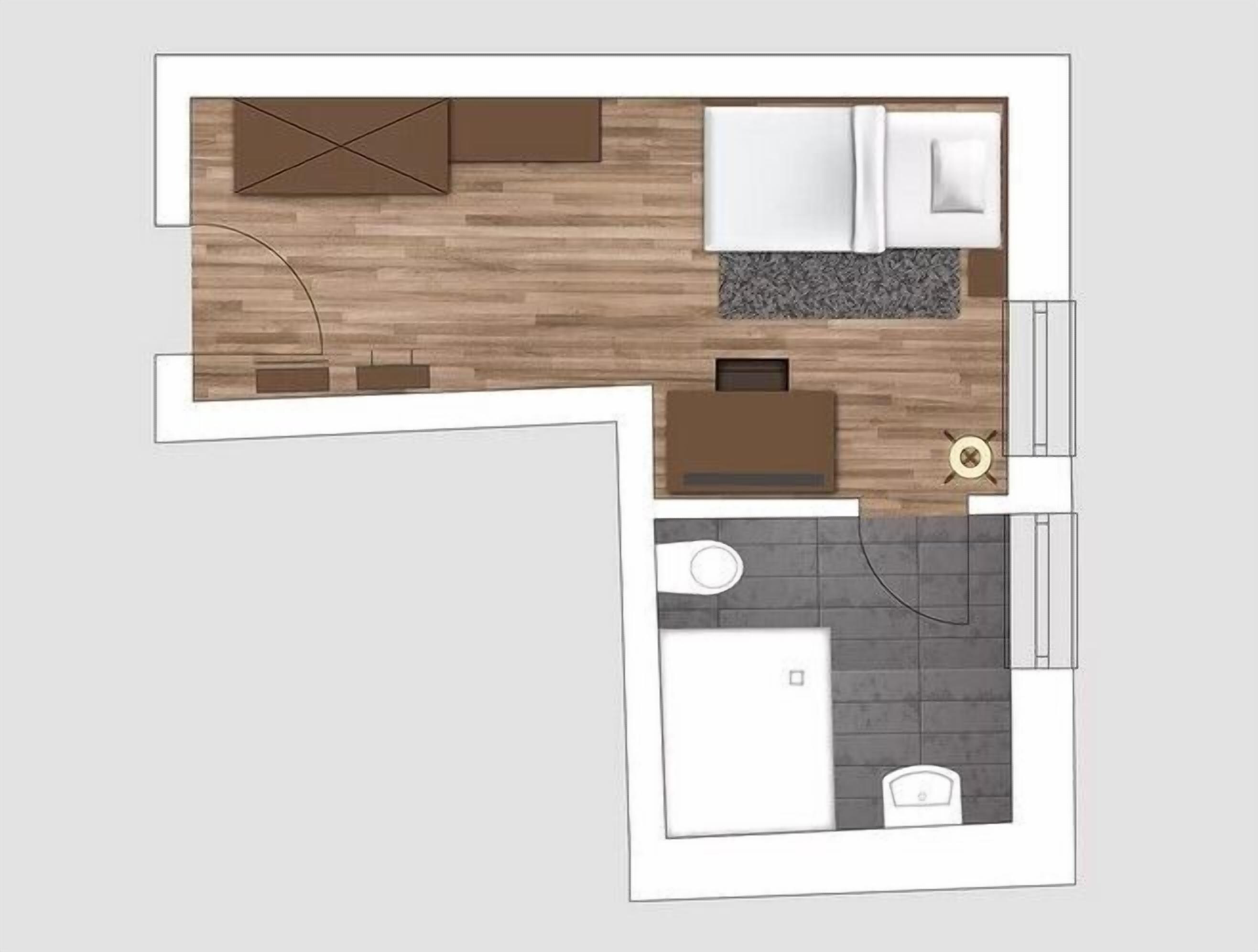 A floor plan of a hotel room with a wooden floor, a bed, a desk, a chair, a small table, and a bathroom.