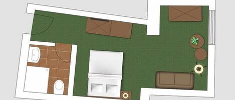 A floor plan of a hotel room with a bathroom, a bed, a small seating area, and a garden view.