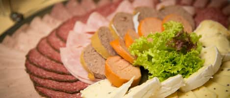 A platter of sliced meats and cheeses.