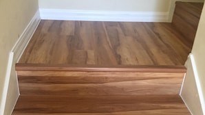 A wooden staircase with white trim. - Family friendly villa, gated community, spa, heated pool, close to theme parks. (Kissimmee)