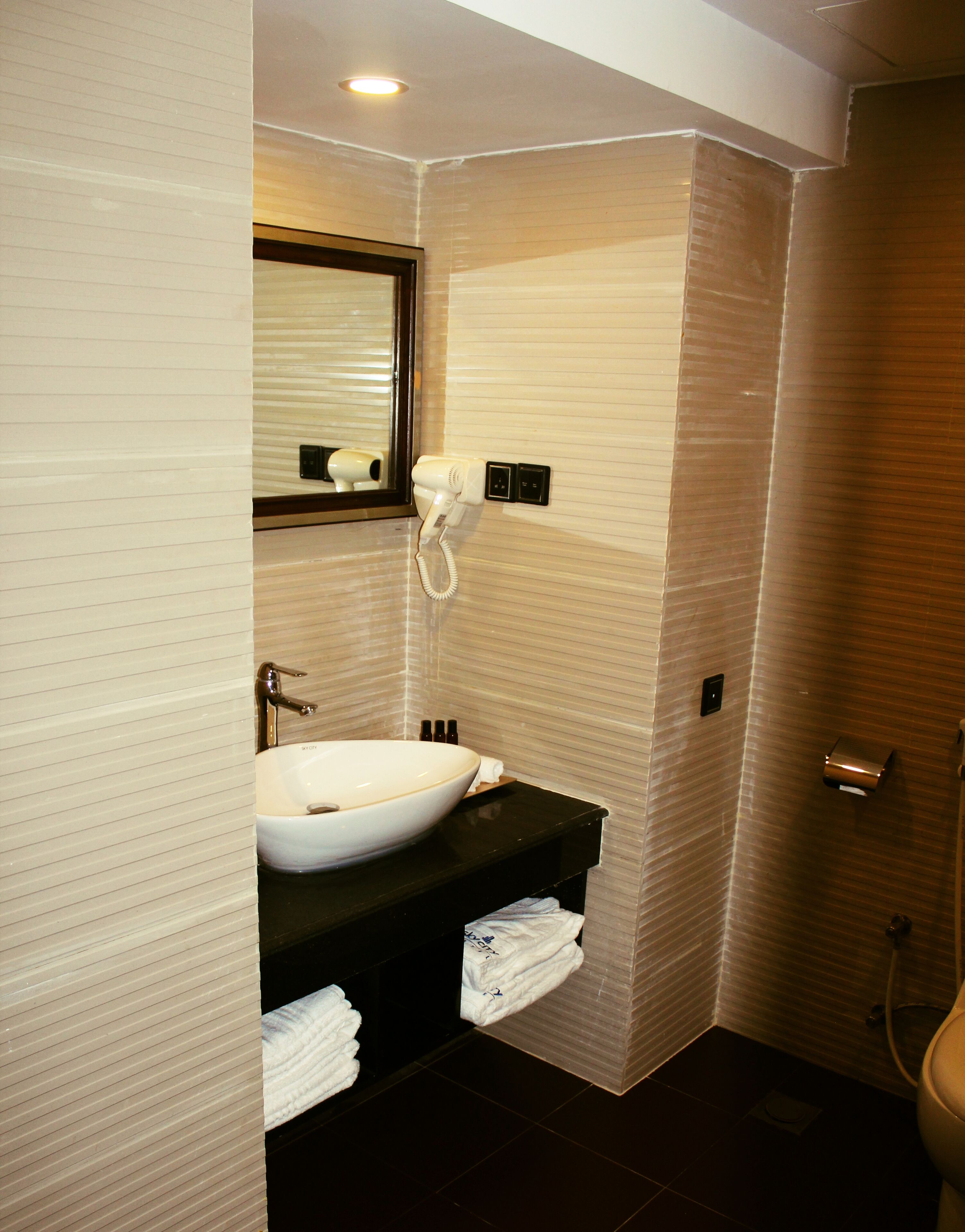 rainfall showerhead, designer toiletries, hair dryer, bathrobes