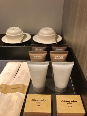 A display of spa products including shower gel, body wash, and soap. - KOO Hotel (Yangon)