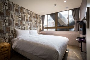 A neatly made bed in a room with a large window, a wall with vintage-style numbers, and a wooden floor. - The Cole Hotel (New Taipei City)