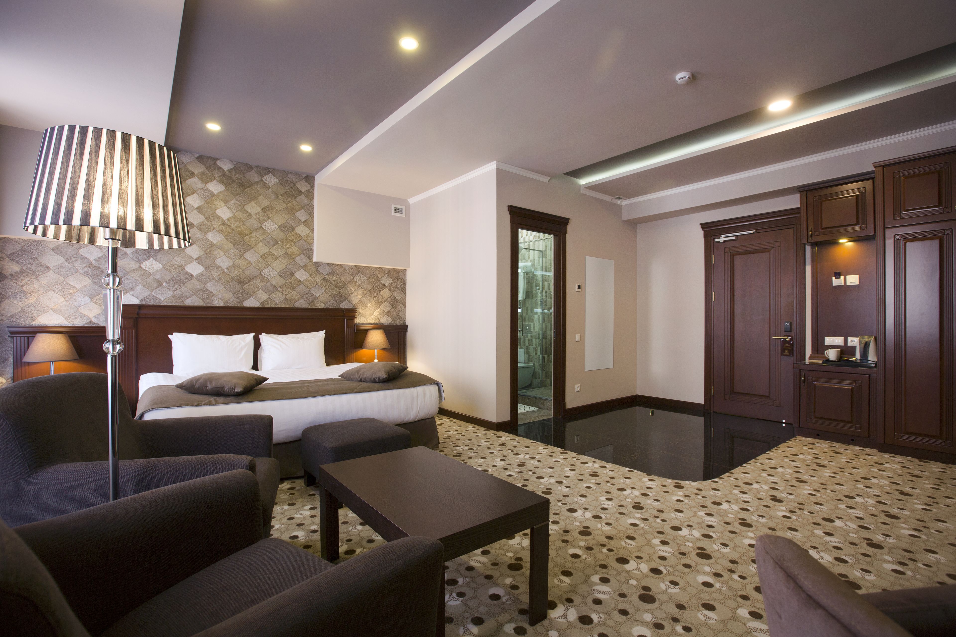 superior double or twin room | living area | flat-screen tv