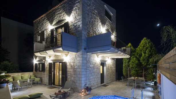 A stone building with a pool, outdoor seating, and a balcony. - Villa Sirocos, Private eco pool, near the beach (Chania)