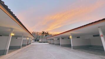A row of single-story buildings with a covered walkway.