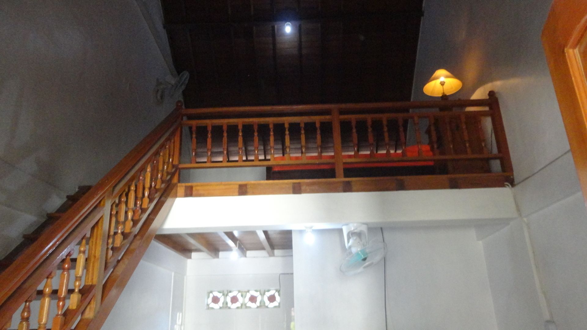 A staircase with wooden balusters leading to a landing.