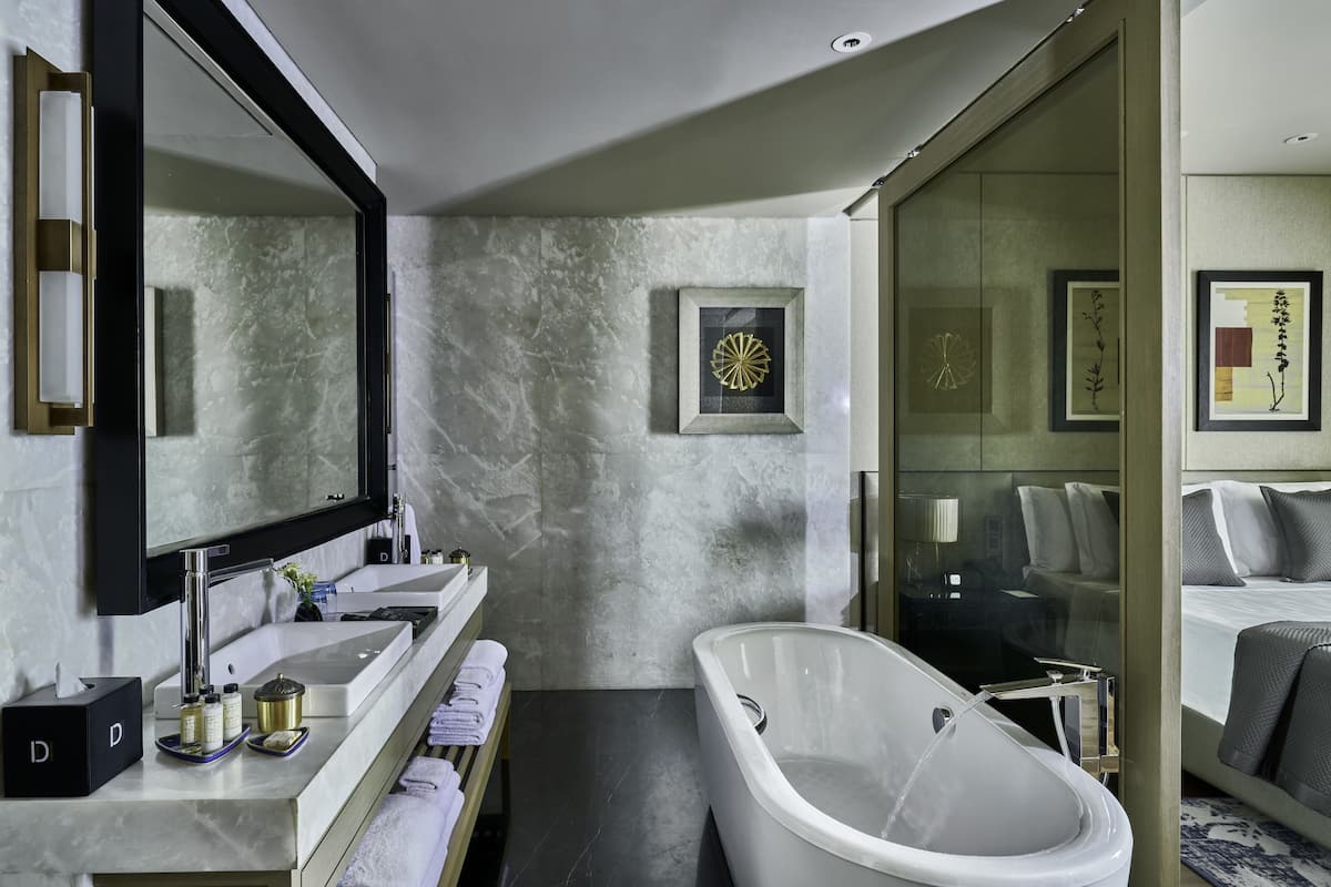 separate bathtub and shower, deep-soaking bathtub, rainfall showerhead