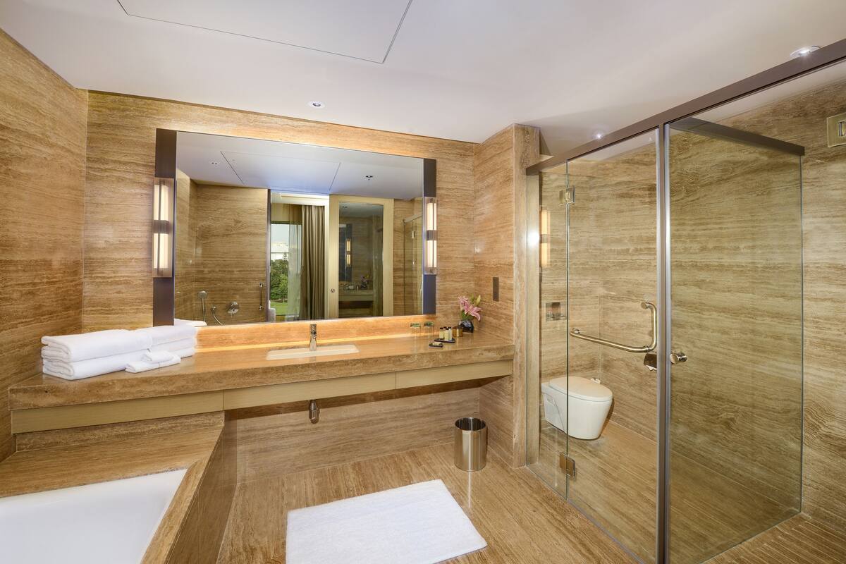 separate bathtub and shower, deep-soaking bathtub, rainfall showerhead