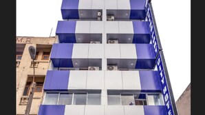 A multi-story building with a sign for the Metro Port City Hotel. - Metro Port City Hotel (Colombo)