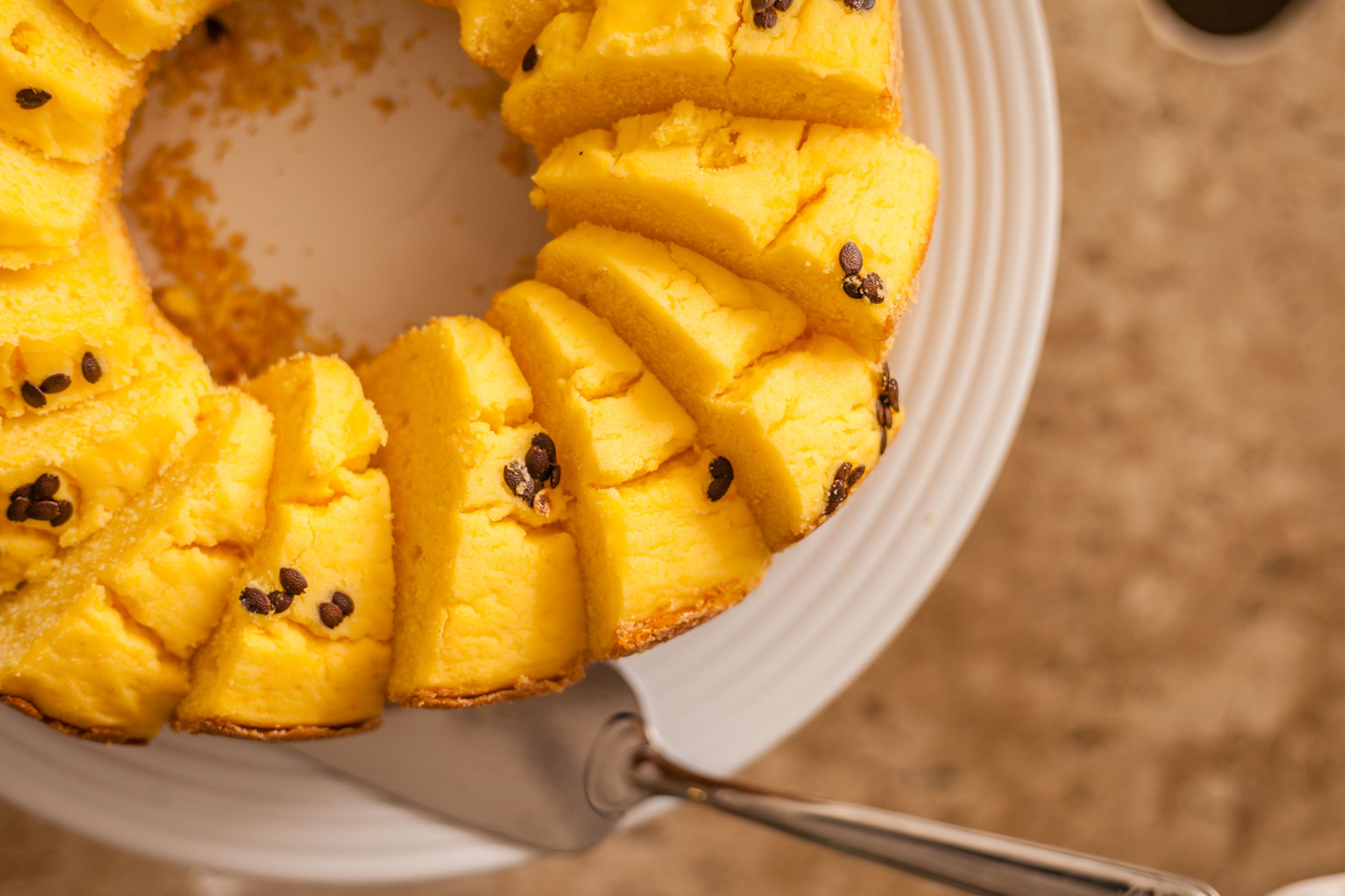 A pineapple upside-down cake on a white plate.