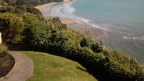 A coastal landscape with a clear view of the beach and ocean. - The Ocean Guesthouse (Weymouth)