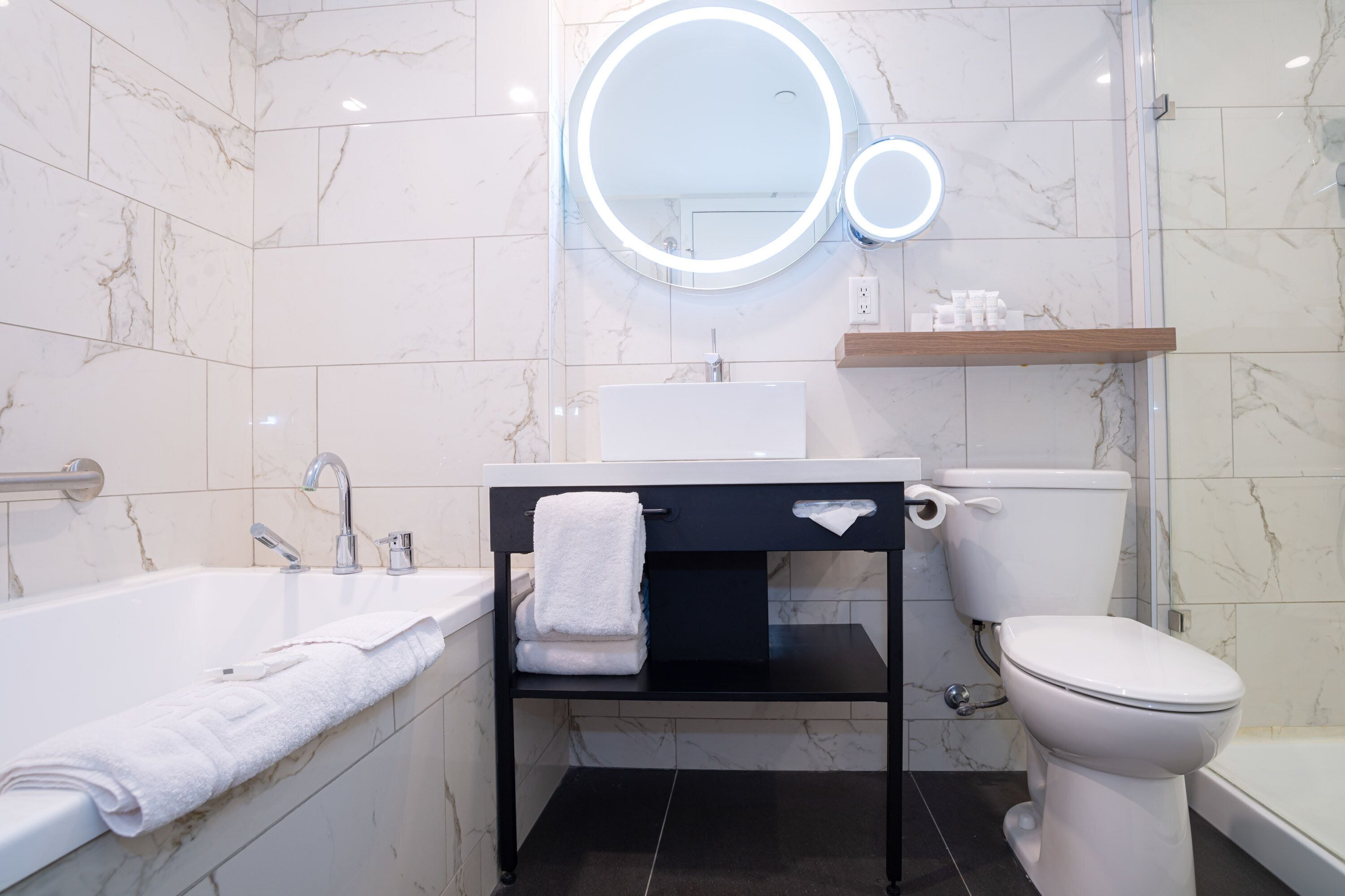 signature room, 1 king bed with sofa bed | bathroom | free toiletries, hair dryer, towels, soap