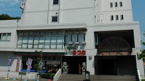 A multi-story hotel with a central entrance and a sign for the Central Hotel Toride. - Central Hotel Toride (Toride)