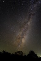 A night sky with stars and the Milky Way.
