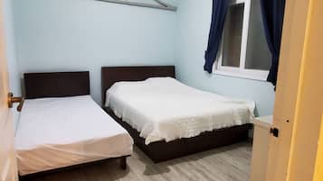 Suite familiar, 2 habitaciones, vista a la ciudad | Cortinas blackout, insonorización, wifi gratis y ropa de cama