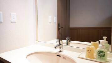 Shower, hair dryer, slippers, towels