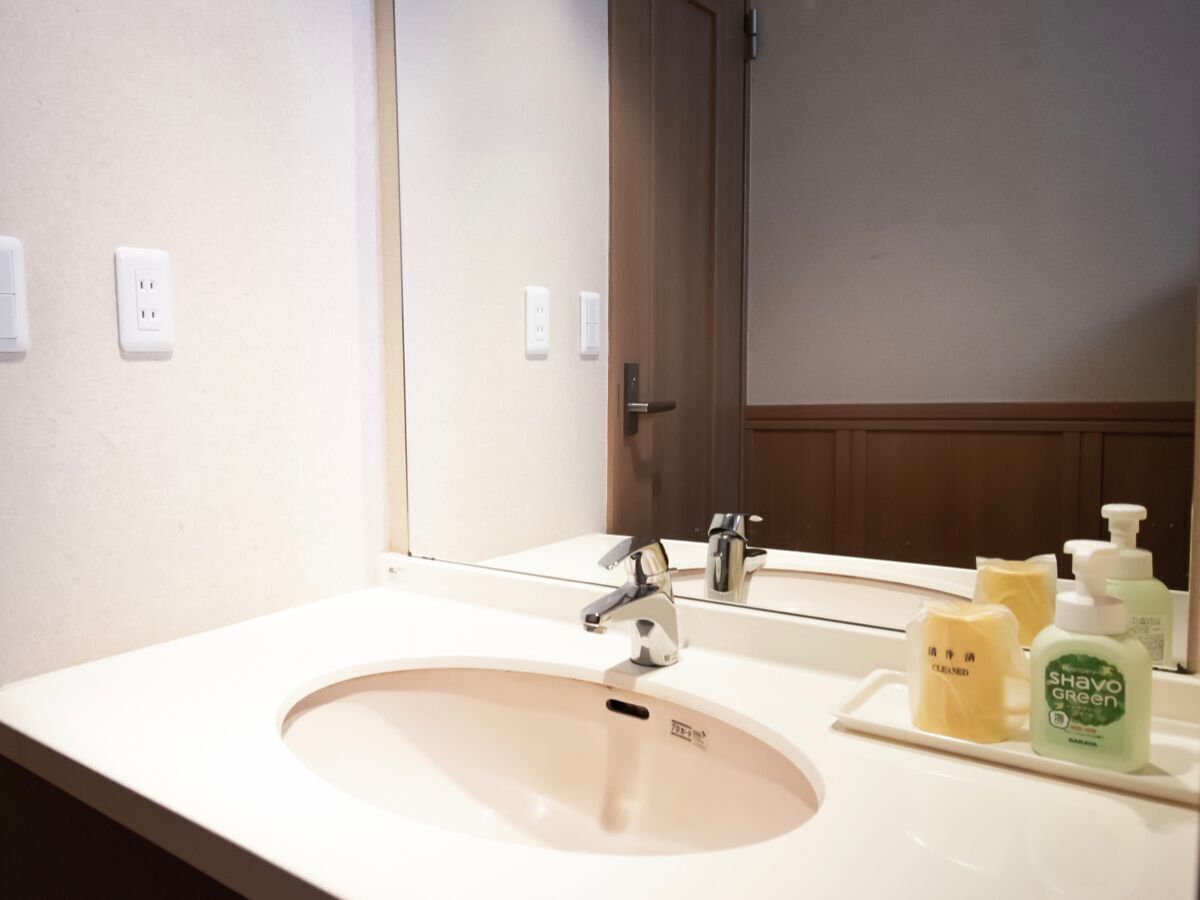 Bathroom | Shower, hair dryer, slippers, towels