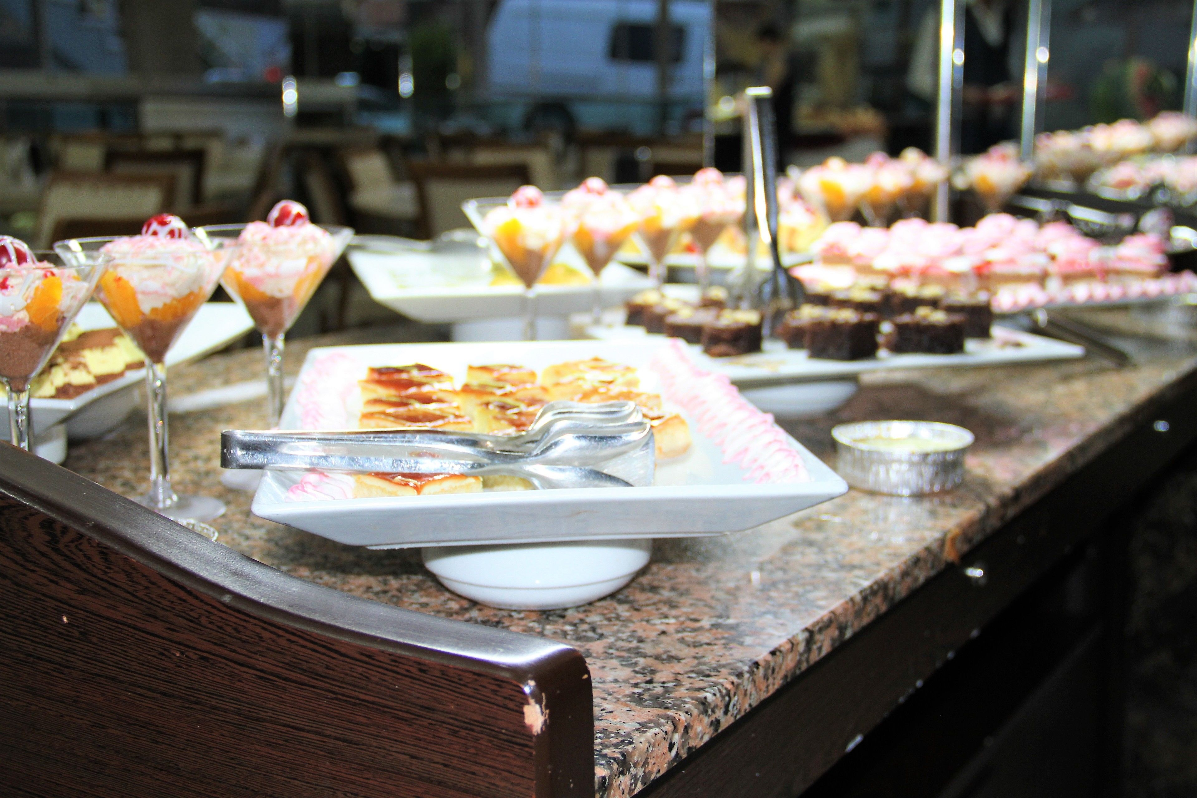 A buffet with various desserts and drinks.