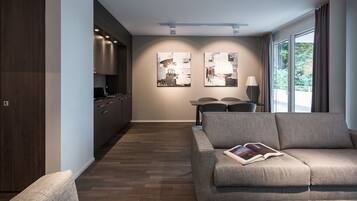 Deluxe Apartment, Terrace | Living room | Flat-screen TV