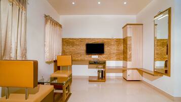 Family Suite, 1 King Bed, Non Smoking, City View | Desk, soundproofing, iron/ironing board, rollaway beds