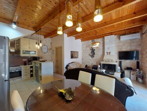 Superior Villa, 2 Bedrooms, Private Pool (Christy) | Living area | 42-inch flat-screen TV with satellite channels, Smart TV, fireplace - Villa Constancia (Chania)