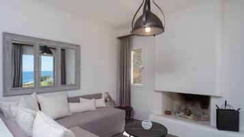 Deluxe Villa, Fireplace, Sea View | Living area | 42-inch flat-screen TV with digital channels, Smart TV, fireplace