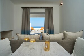 Honeymoon Villa, Fireplace, Sea View | Living area | 42-inch flat-screen TV with digital channels, Smart TV, fireplace