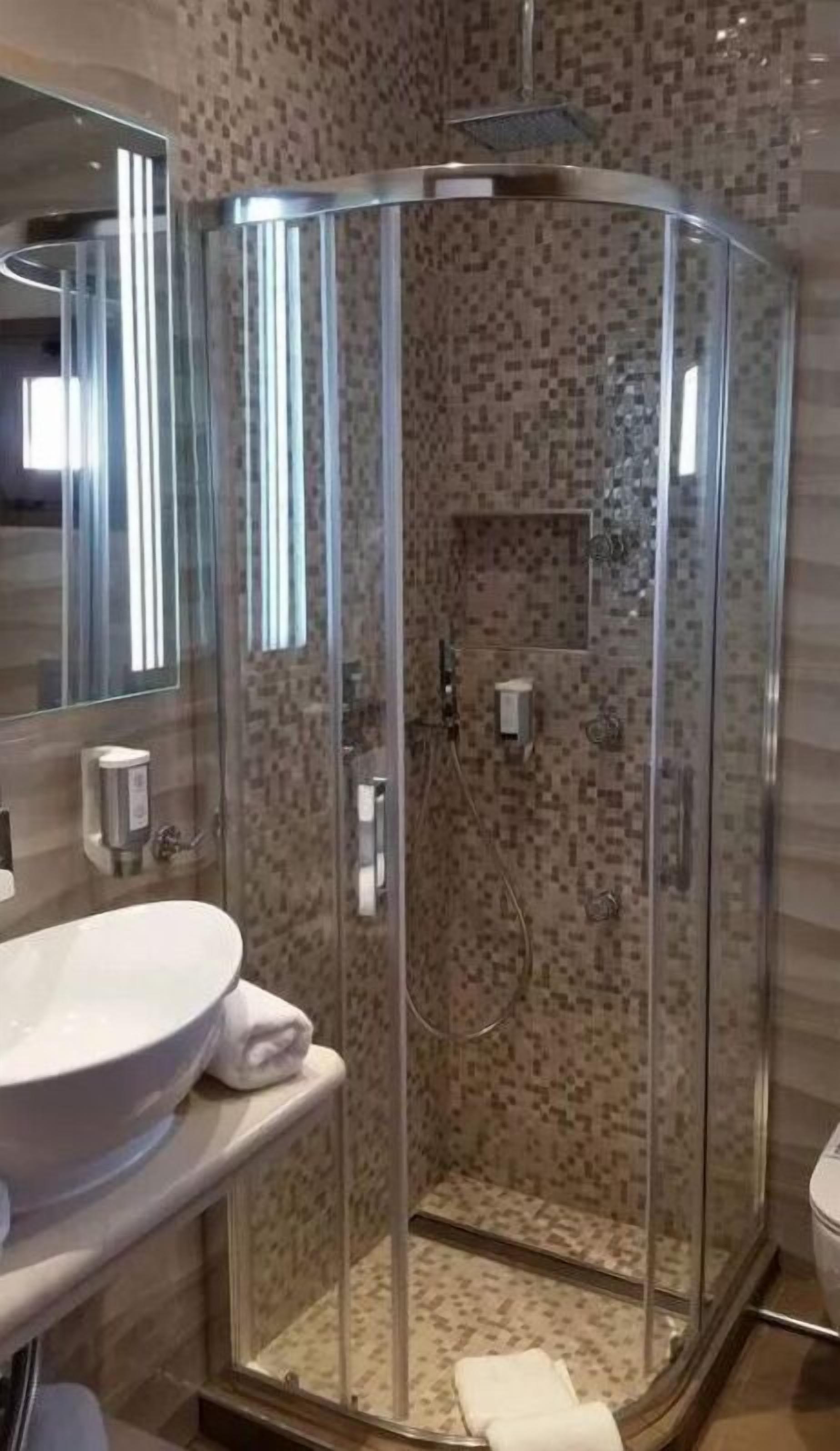 panoramic double room (olympus view) | bathroom | designer toiletries, hair dryer, slippers, towels