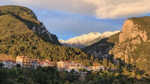 A mountainous village with buildings nestled among the hills. - Xenios Dias Boutique Hotel (Dio-Olympos)
