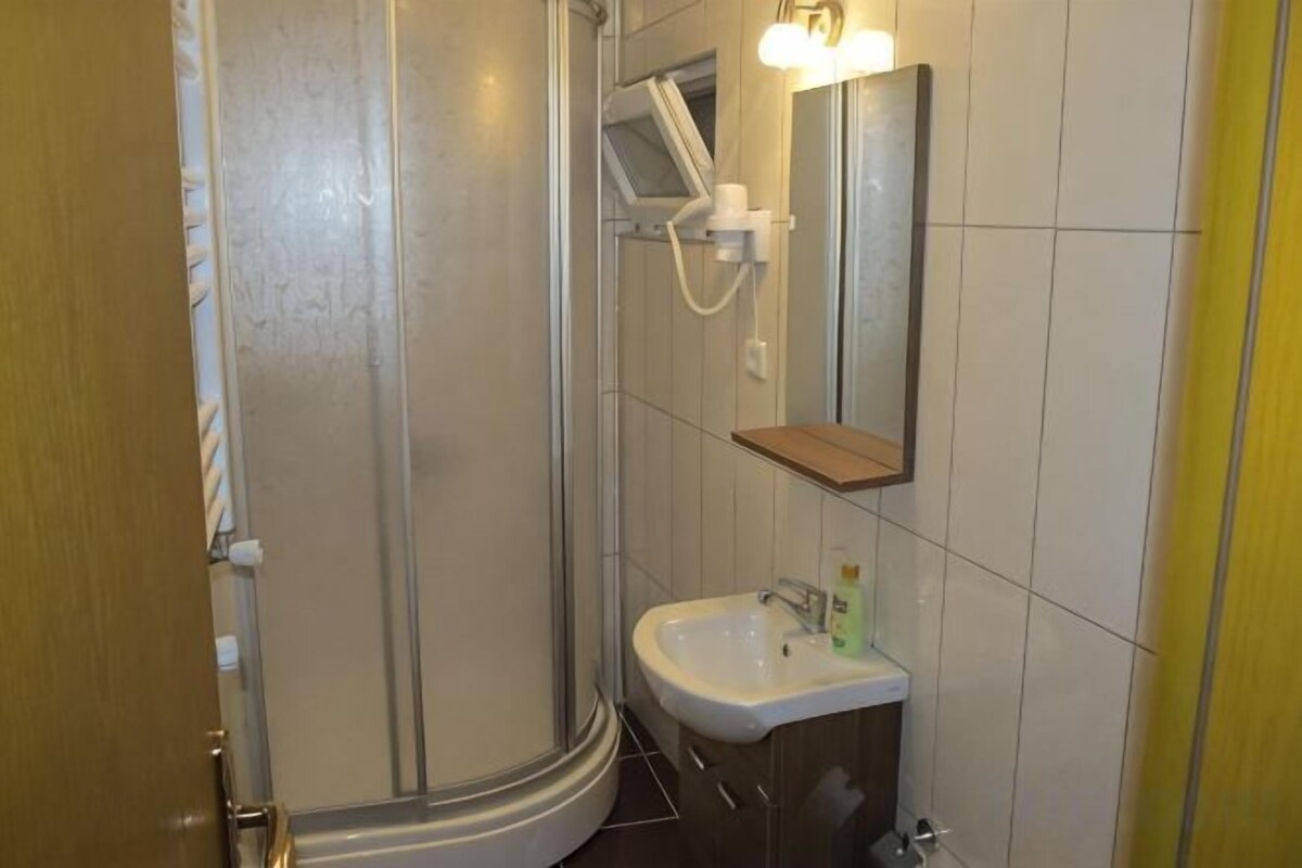 Bathroom | Shower, free toiletries, hair dryer, slippers